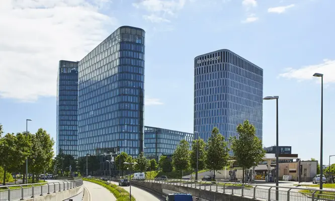 Real Estate Photography 1 Professional real estate photography of the Bavaria Towers in Munich – exterior shot of modern office buildings and urban infrastructure