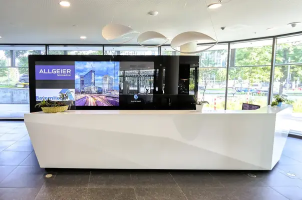 Real Estate Photography 2 Modern commercial real estate photography Munich – interior shot of a futuristic office reception desk at Bavaria Towers