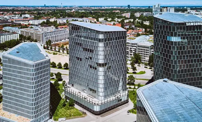 Real Estate Photography 4 Aerial commercial real estate photography Munich – birds-eye view of the modern Bavaria Towers business district and office skyscrapers